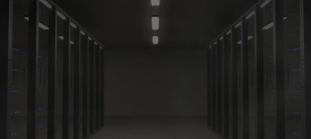 image of servers stacked on both sides of a dark room